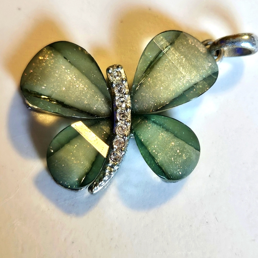 Beautiful silver butterfly pendant with green, shimmer, and rhinestones